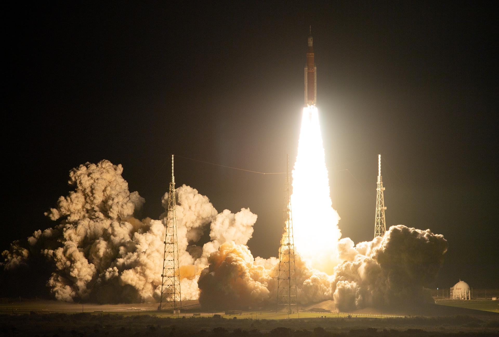 A rocket launching into the night sky